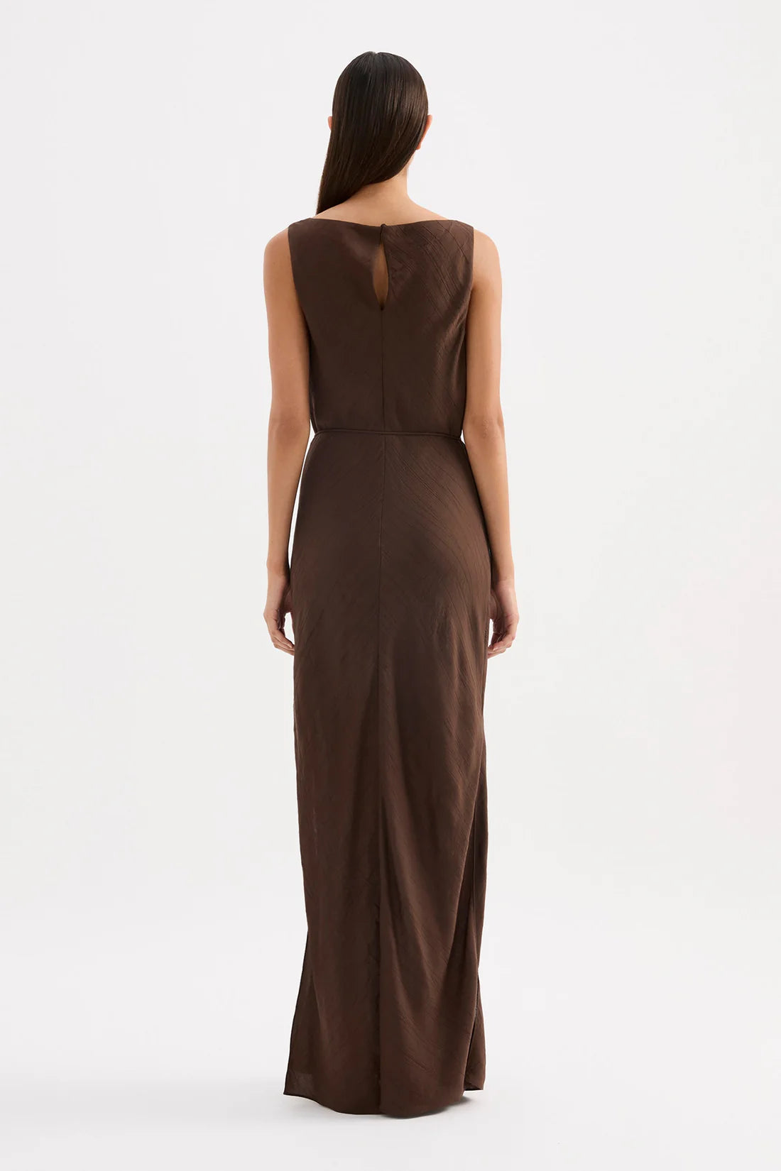 Brown dress worn by a model on a white background